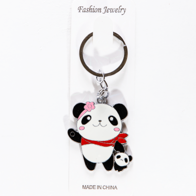 Металлический брелок панда с красным шарфом и игрушкой